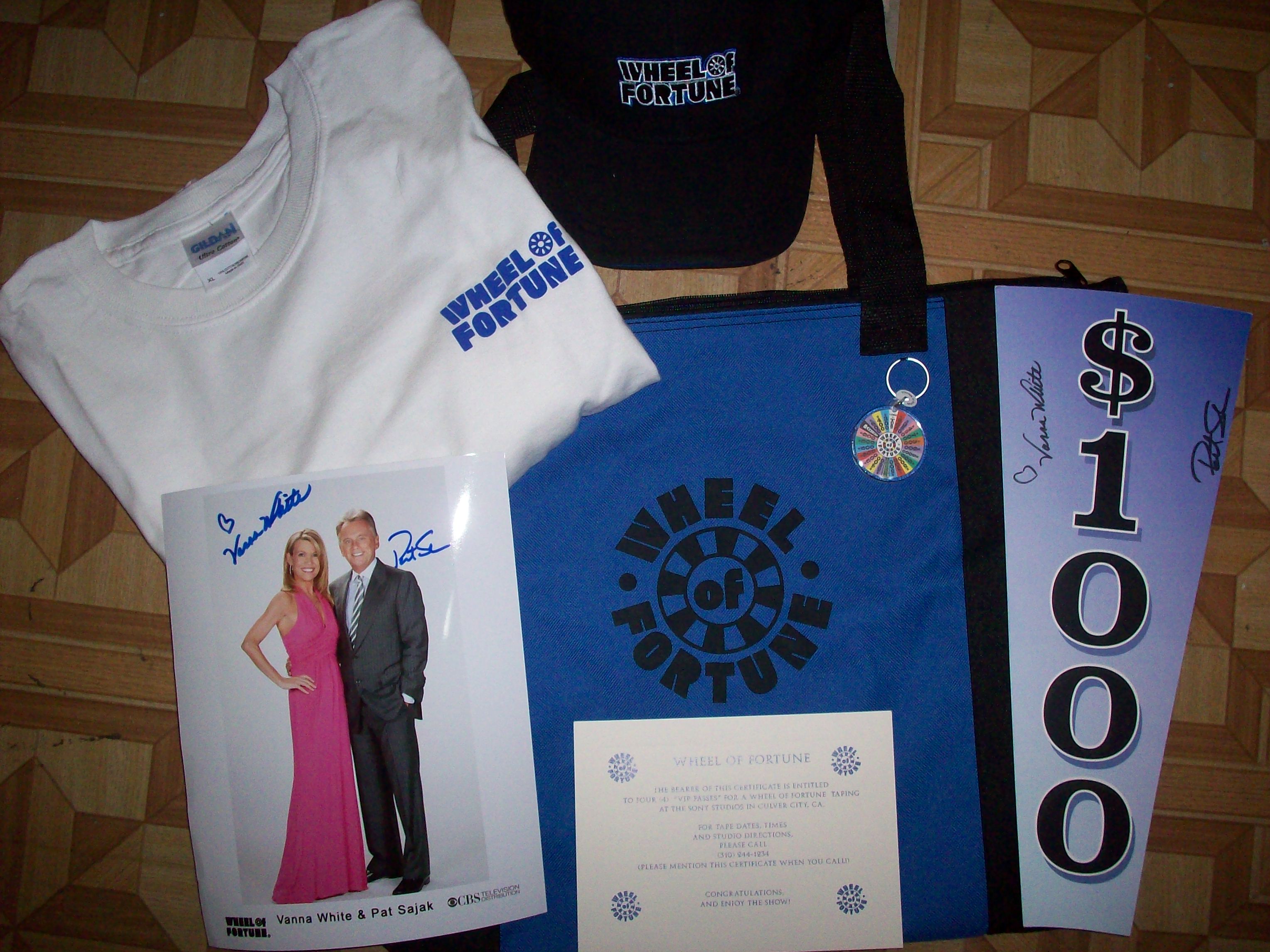 Wheel of Fortune has donated: -An authentic tshirt from the show -An authentic hat -Keychain -Wheel of Fortune Tote Bag -An autographed photo by both Pat Sajak and Vanna White -An autographed piece of the wheel by both Pat Sajak and Vanna White -A certificate for 4 VIP PASSES to an Episode of Wheel of Fortune!!!