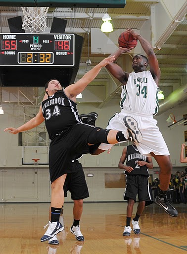 Melvin Tabb of Enloes Goes Up and Over Millbrooks defender