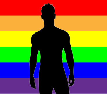 Gay man with rainbow flag